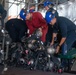 Firefighters participate in a major fire drill aboard the John C. Stennis
