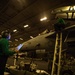 Sailors Perform Maintenance On A Super Hornet