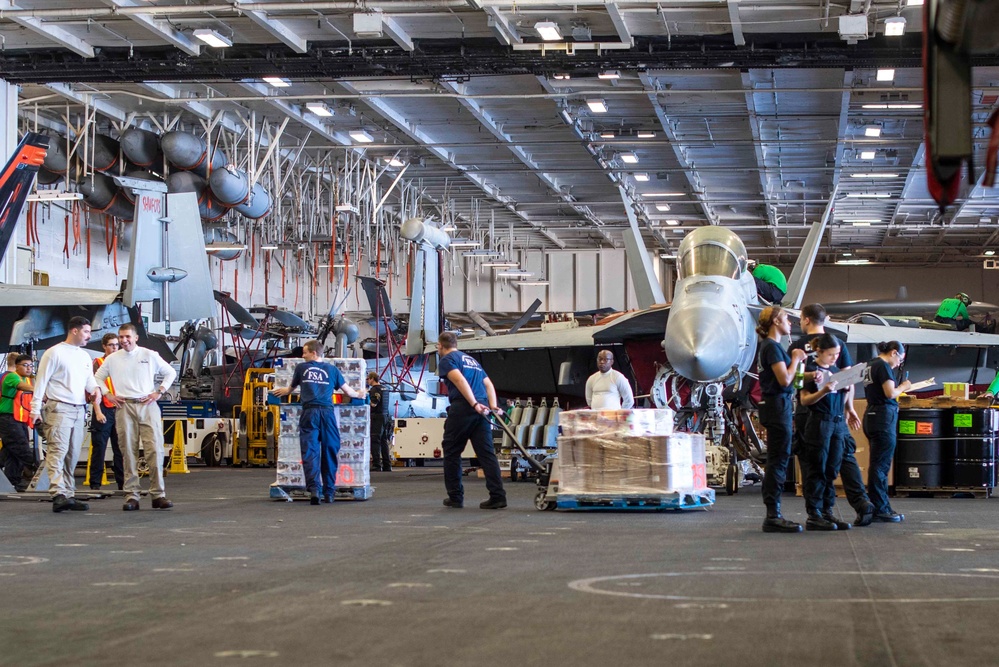 U.S. Navy Sailors Onload Supplies