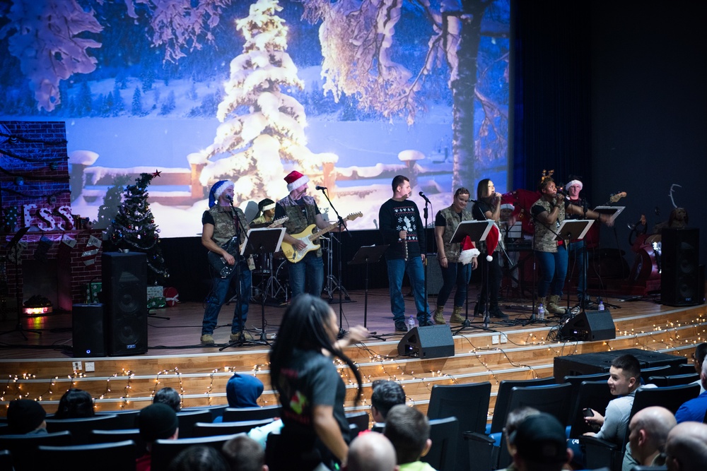 “Rock” band ushers in Holiday season for 386 AEW, coalition teammates