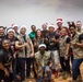 “Rock” band ushers in Holiday season for 386 AEW, coalition teammates