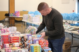 Employees and Volunteers help bring Holiday Magic to Guard families