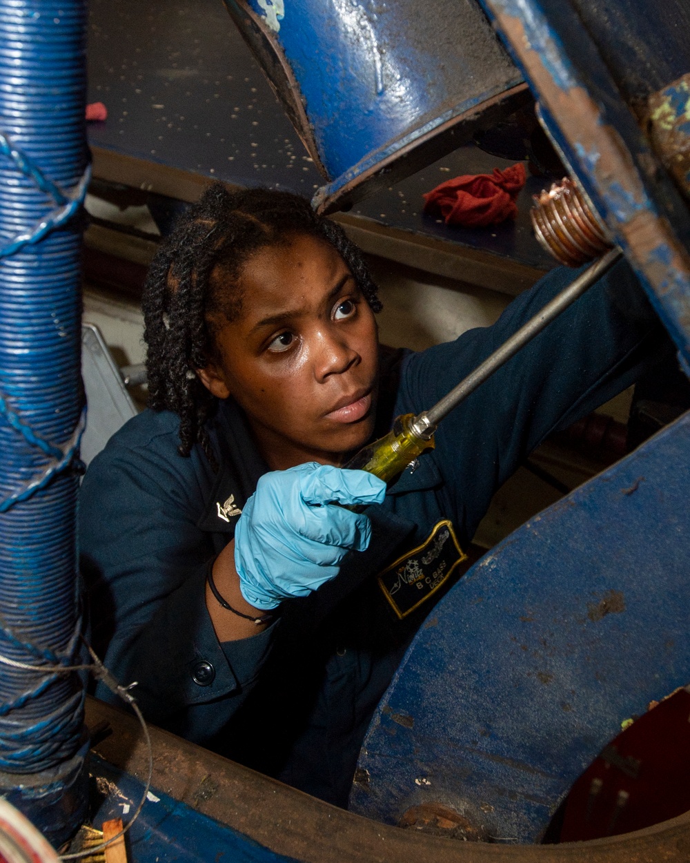 Sailor Performs Maintenance On Ballistics Hatch