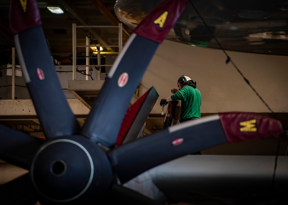 Sailors Perform Maintenance On An E-2C Hawkeye