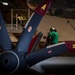 Sailors Perform Maintenance On An E-2C Hawkeye