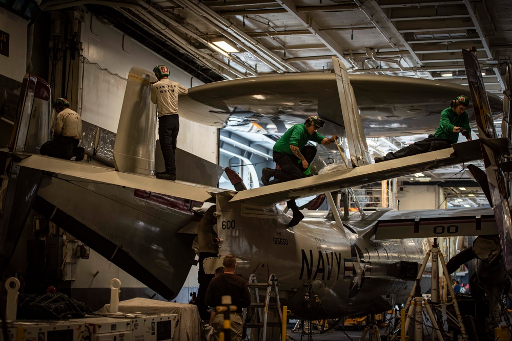 Sailors Perform Maintenance On An E-2C Hawkeye