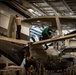 Sailors Perform Maintenance On An E-2C Hawkeye