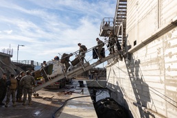 II Marine Expeditionary Force Marine Leave the USNS Trenton