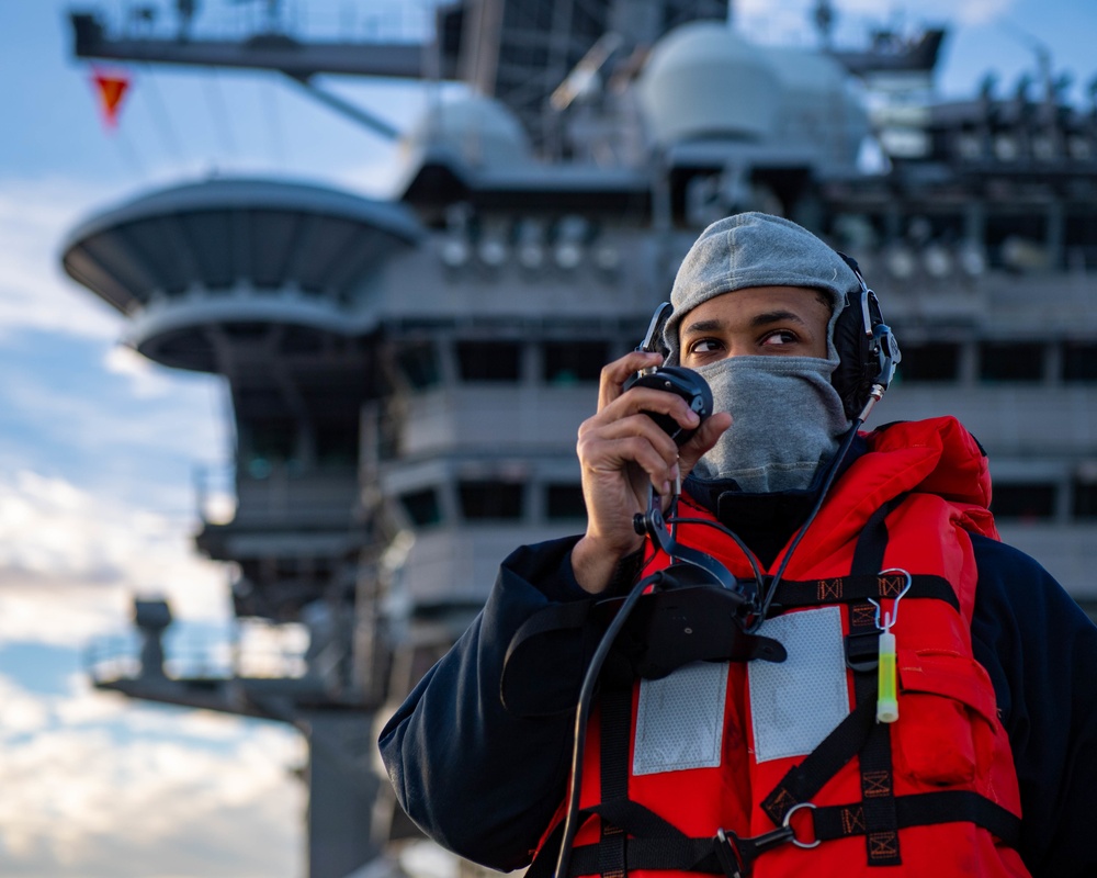 Sailor Uses a Sound Powered Telephone During a Replenishment at Sea Aboard CVN70