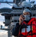 Sailor Uses a Sound Powered Telephone During a Replenishment at Sea Aboard CVN70