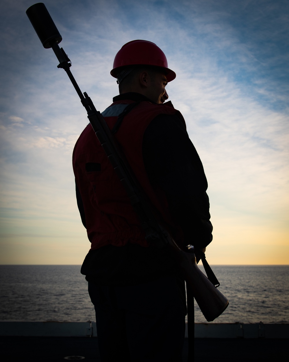 Sailor Stands By To Fire a Shot Line During a Replenishment at Sea Aboard CVN70