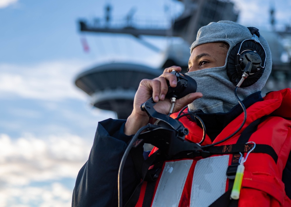 Sailor Uses a Sound Powered Telephone During a Replenishment at Sea Aboard CVN70