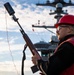 Sailor Prepares to Fire a Shot Line During a Replenishment at Sea Aboard CVN 70