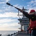 Sailor Prepares to Fire a Shot Line During a Replenishment at Sea Aboard CVN 70