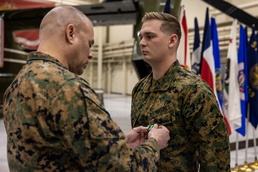 Cpl. Chase Portello receives a Navy Commendation Medal for life saving actions