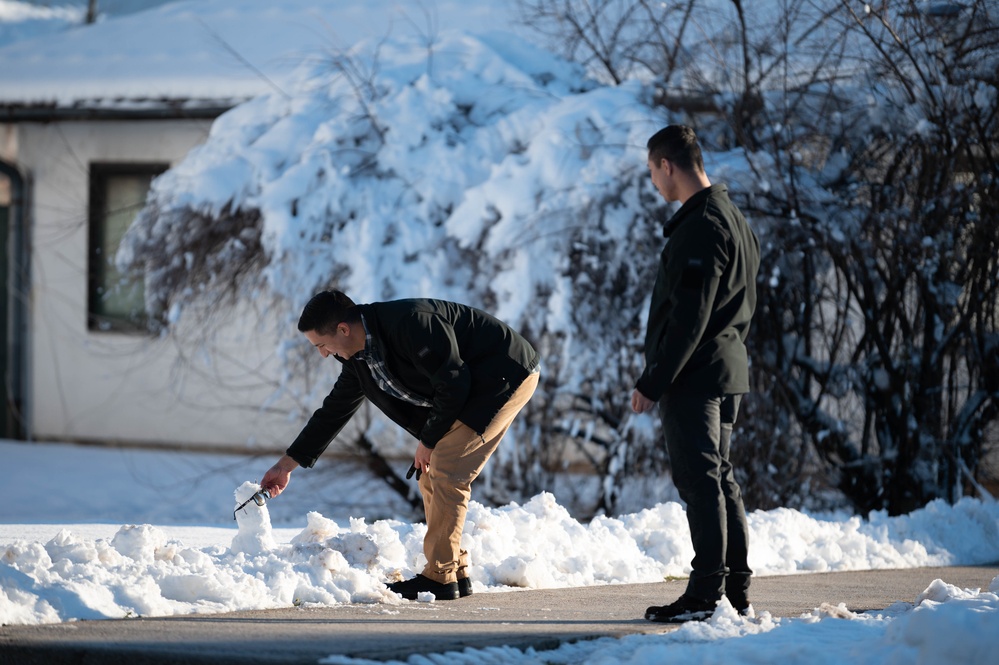 U.S. Marine Corps Sgt. Angel Paz makes a snowman