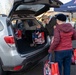 Volunteers from the 142nd Wing and USO participate in &quot;Everything but the Turkey&quot; food drive