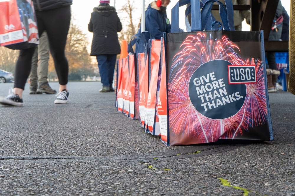 Volunteers from the 142nd Wing and USO participate in &quot;Everything but the Turkey&quot; food drive