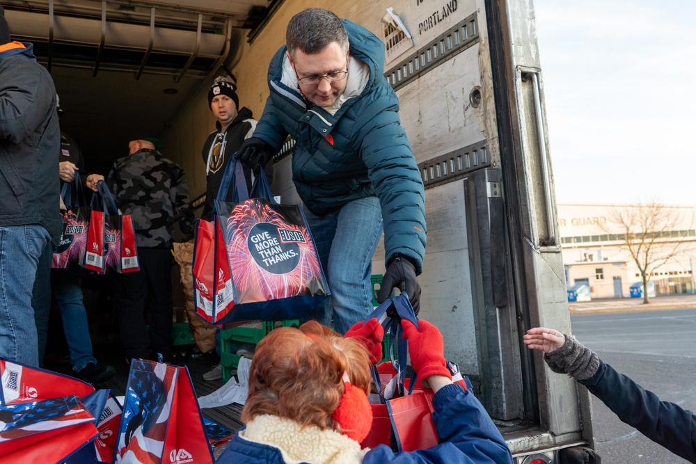 Volunteers from the 142nd Wing and USO participate in &quot;Everything but the Turkey&quot; food drive
