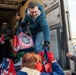 Volunteers from the 142nd Wing and USO participate in &quot;Everything but the Turkey&quot; food drive
