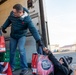 Volunteers from the 142nd Wing and USO participate in &quot;Everything but the Turkey&quot; food drive