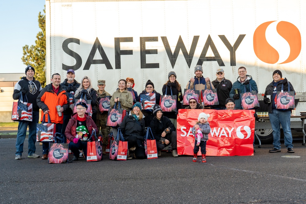 Volunteers from the 142nd Wing and USO participate in &quot;Everything but the Turkey&quot; food drive