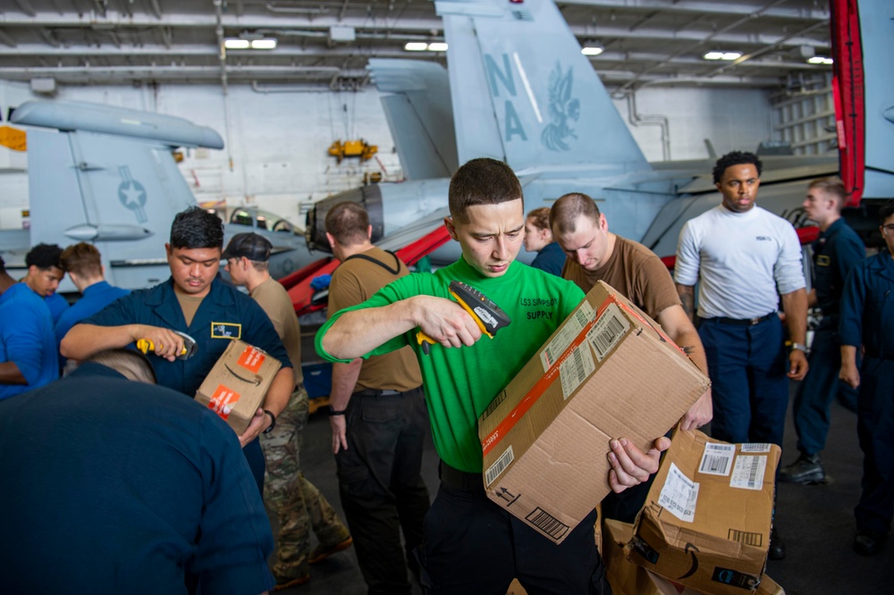 U.S. Navy Sailors Sort Mail