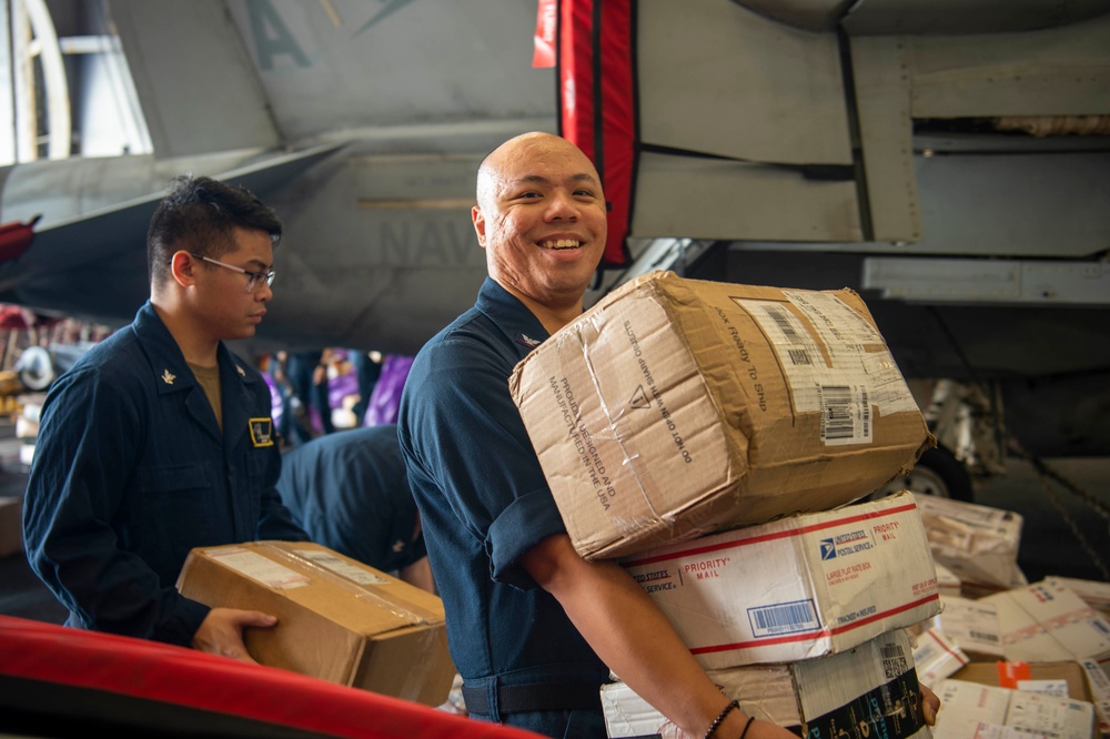 U.S. Navy Sailors Sort Mail