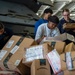 U.S. Navy Sailors Sort Mail