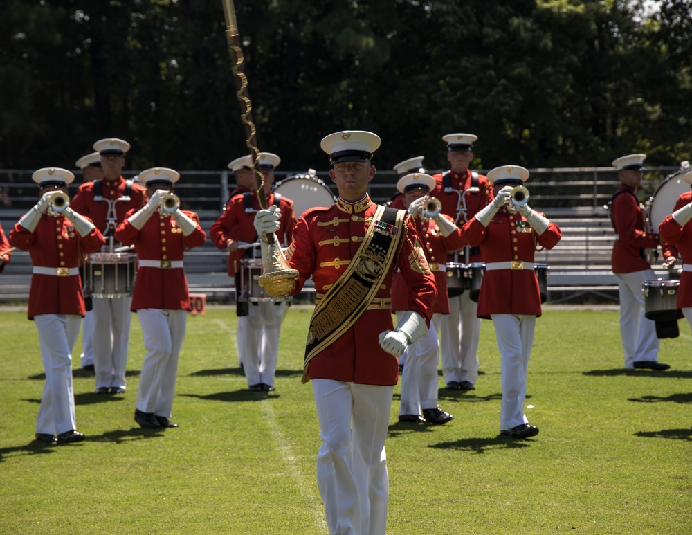 Marines with the Battle Color Detachment perform for audiences at Cary High-School