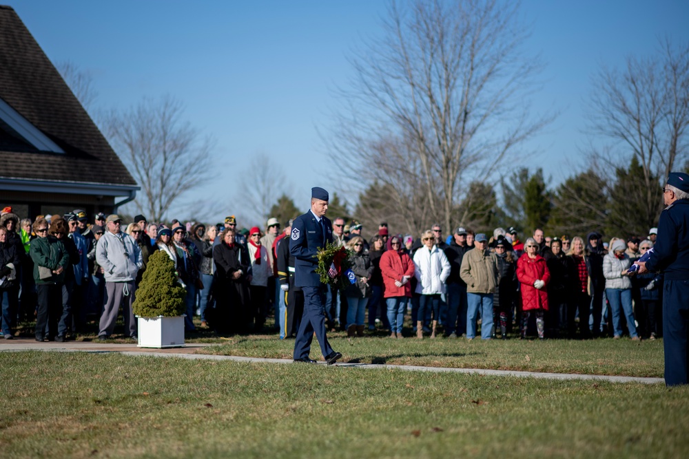 Air Force Mortuary Affairs Operations first sergeant, lays wreath at Wreaths Across America ceremony