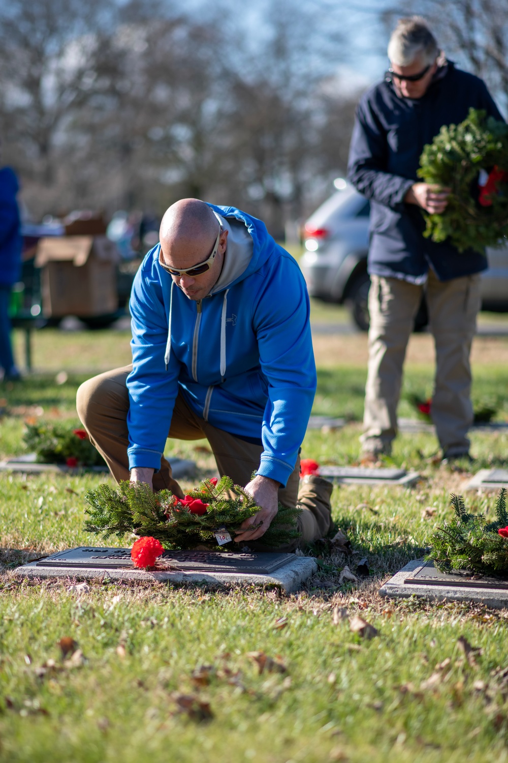 911th Security Forces Squadron squad leader, lays a wreath at a veteran’s gravesite at the Delaware Veterans Memorial Cemetery