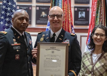 Army communication warrant officer get promoted during ceremony
