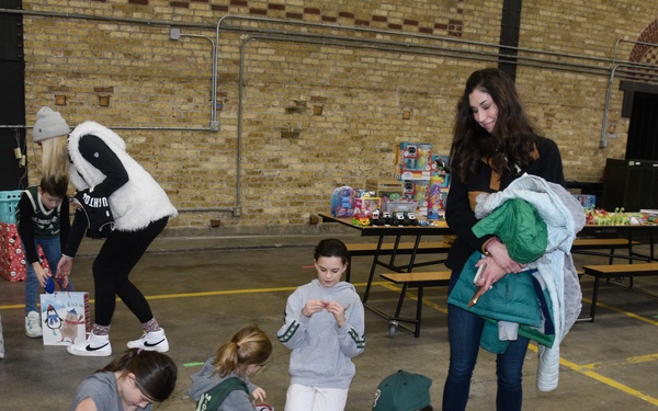 Milwaukee Buck scores winning play with families of deployed Wisconsin Guard members