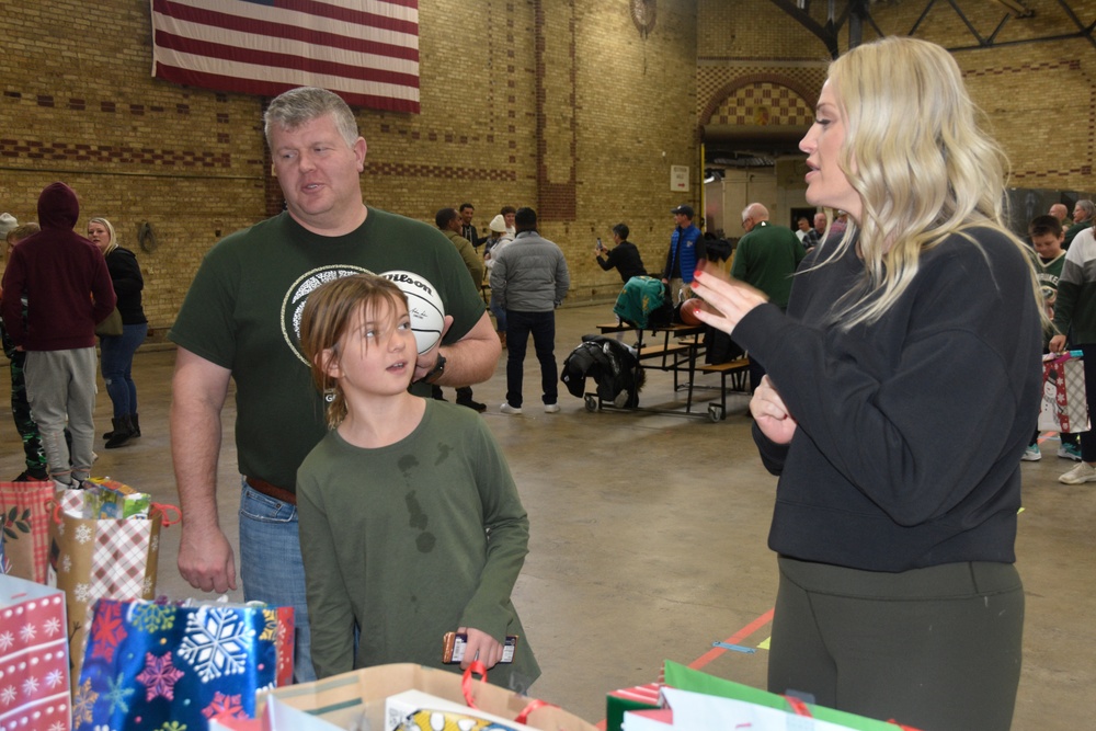 Milwaukee Buck scores winning play with families of deployed Wisconsin Guard members