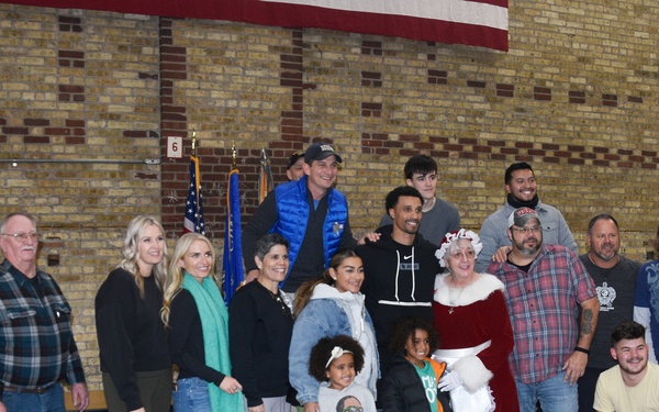 Milwaukee Buck scores winning play with families of deployed Wisconsin Guard members