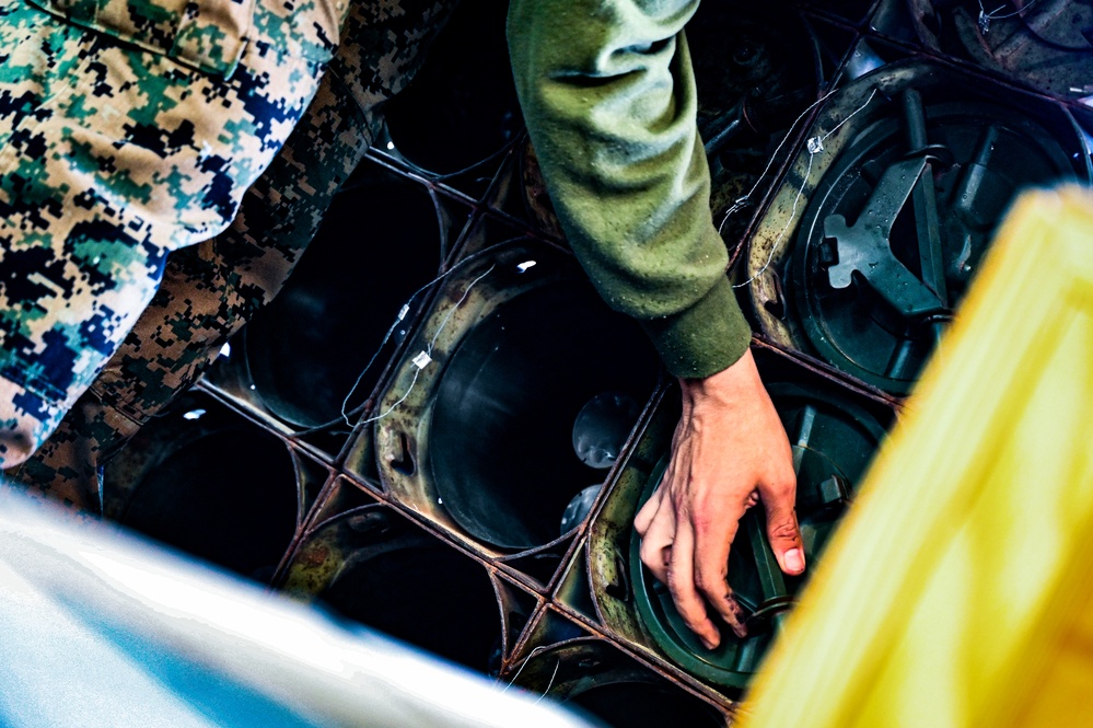 MAG-49 Marines assemble Lethal Ordnance with the help of 305th Airmen