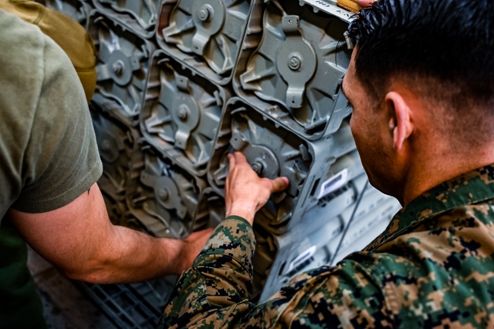 MAG-49 Marines assemble Lethal Ordnance with the help of 305th Airmen