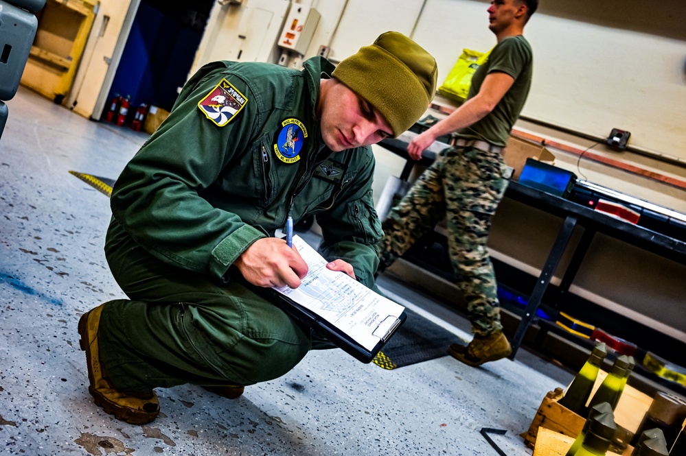 MAG-49 Marines assemble Lethal Ordnance with the help of 305th Airmen