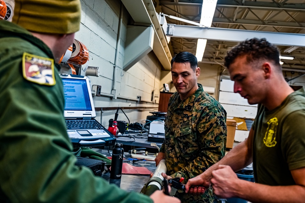 MAG-49 Marines assemble Lethal Ordnance with the help of 305th Airmen