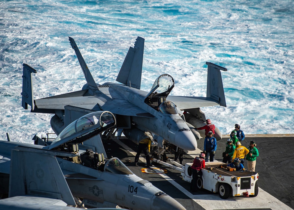 Sailors Taxi Aircraft On The Flight Deck