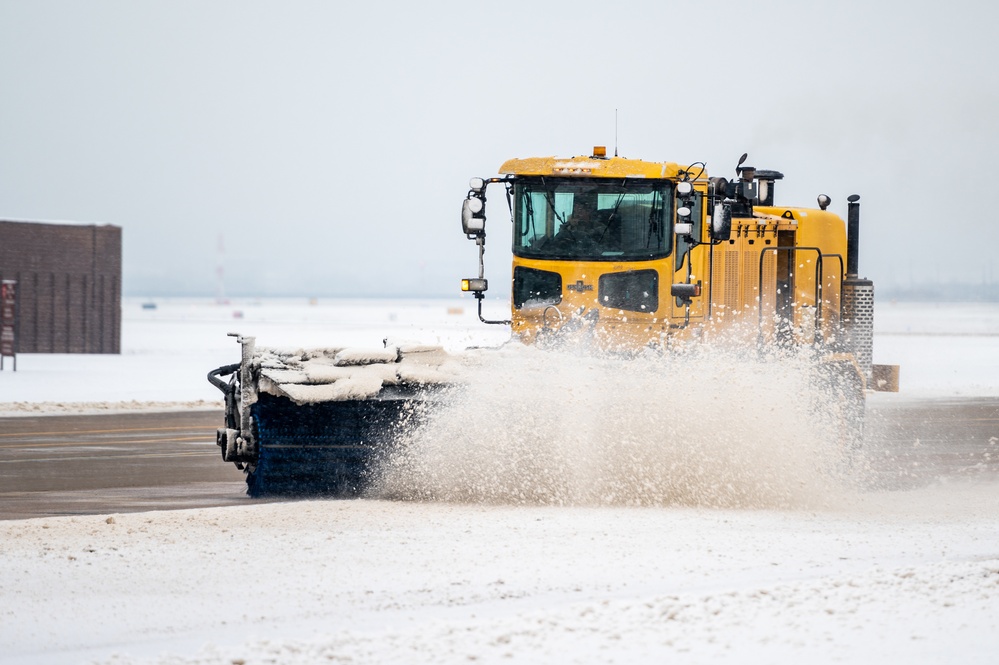 51st CES clears snow from flightline