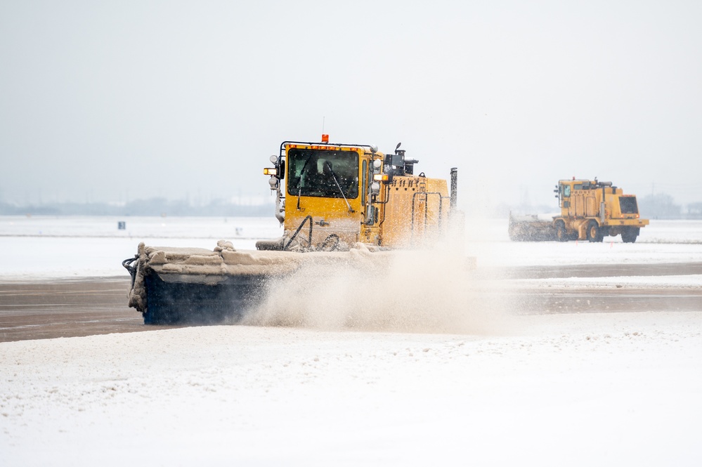 51st CES clears snow from flightline