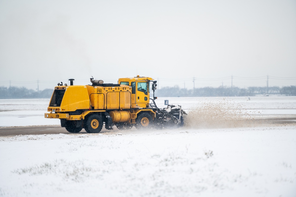 51st CES clears snow from flightline