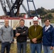 Local and Federal community members take a group photo to celebrate much needed dredging at the Mouth of the Rouge River, Ore.