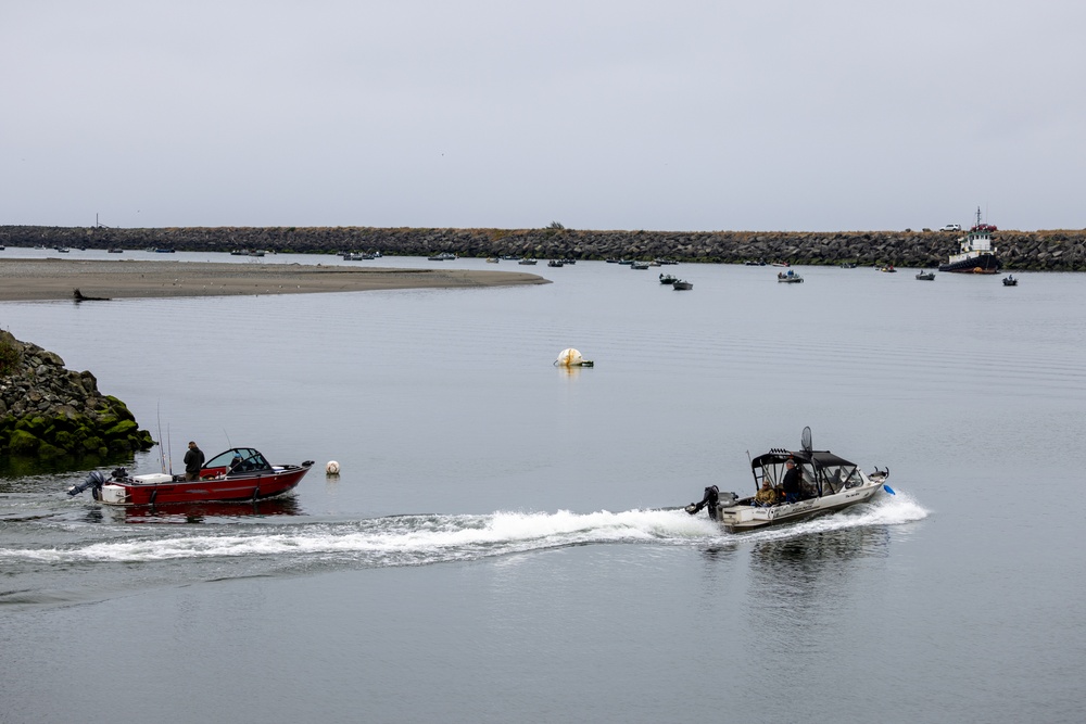 People enjoying recreating safely in the maintained estuary at Gold Beach, Ore.