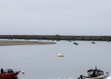 People enjoying recreating safely in the maintained estuary at Gold Beach, Ore.