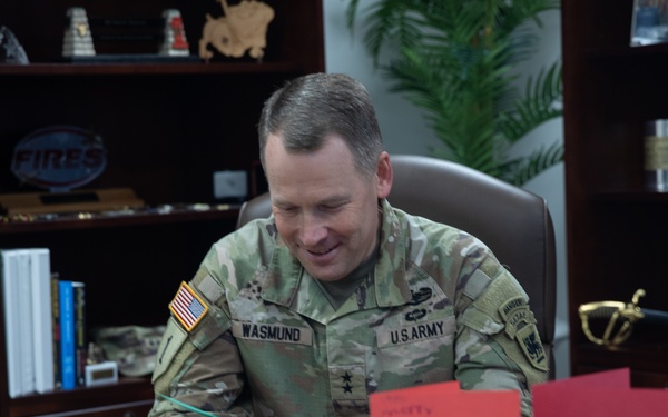 Maj. Gen. Todd R. Wasmund opens holiday cards from Centerville Ohio’s Primary Village North Elementary School