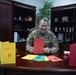 Maj. Gen. Todd R. Wasmund opens holiday cards from Centerville Ohio’s Primary Village North Elementary School