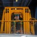 Sailor Lifts Cargo With Fork Lift